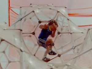 child climbing in a bubble